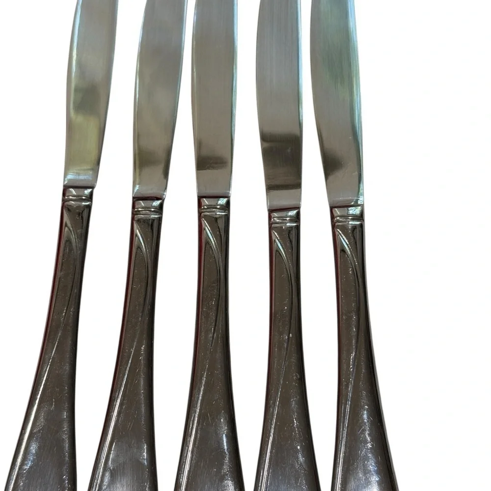 Oneida Flight Reliance 5 Stainless Serrated Dinner Knives and one Butter Knife